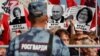 A rally against pension reform in Moscow on September 22. The placards read "Public Enemy" and show President Vladimir Putin (center), Federation Council speaker Valentina Matviyenko (left), and Central Bank Governor Elvira Nabiullina.