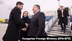 U.S. Secretary of State Mike Pompeo (center) is welcomed upon his arrival at Liszt Ferenc International Airport in Budapest on February 11.