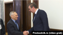 Serbian President Aleksandar Vucic (right) met with Russian Ambassador to Belgrade Aleksandr Bocan Harchenko before the security meeting on November 21. 