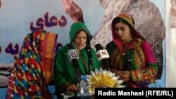 FILE: A gathering in Logar demand rights and security for women.