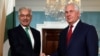 U.S. Secretary of State Rex Tillerson, right, shakes hands with Pakistani Foreign Minister Khawaja Asif before a meeting at the State Department in Washington on October 4.