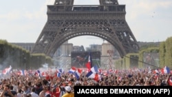 France supporters cheer near Eiffel Tower in Paris.