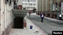 Blood stains the sidewalk in front of the parliament building in Grozny on October 19.