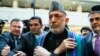 Former Afghan President Hamid Karzai (center) arrives for "intra-Afghan" peace talks in Moscow on February 5. 