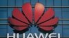 CHINA -- The Huawei logo stands on a Huawei office building in Dongguan in China’s southern Guangdong province, December 18, 2018