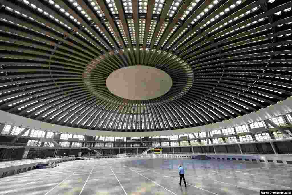 A security guard inside the Belgrade Fair -- the site of major trade fairs in the Serbian capital. Vojin Muncin, manager of a sightseeing company in Belgrade, told Reuters his company now has dozens of people each week booking tours &ldquo;around city landmarks built from the 1950s to the 1980s.&rdquo; 