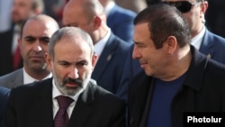 Armenia -- Prime Minister Nikol Pashinian (L) attends the inauguration of a ceramics plant mostly owned by Gagik Tsarkian (R), November 7, 2019. 