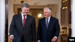 U.S. Secretary of State Rex Tillerson (right) meets with Ukrainian President Petro Poroshenko at the Department of State in Washington on June 20.