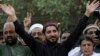 Leader of the Pashtun Tahafuz Movement (PTM) Manzoor Pastheen (C) waves to supporters during a demonstration in Lahore on April 22.