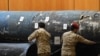 SAUDI ARABIA -- Saudi soldiers reveal the remains of missiles, that a military coalition led by Saudi Arabia claim are Iranian during a press conference at the Armed Forces club in Riyadh, March 26, 2018
