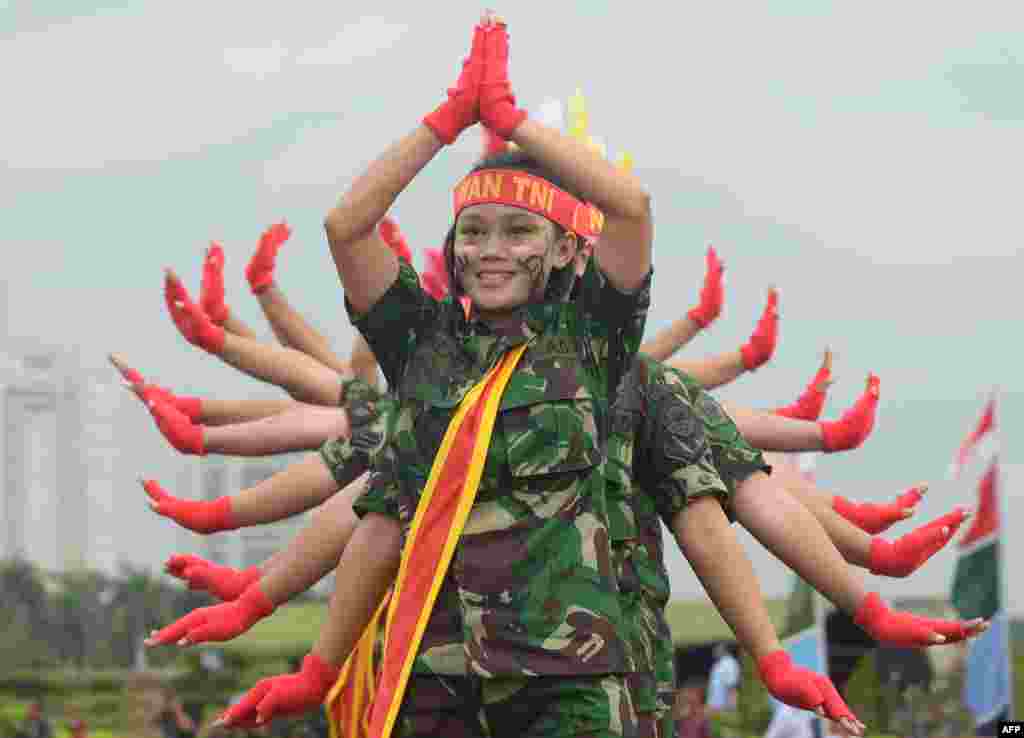 Female members of the Indonesian armed forces perform as they mark Kartini Day in Jakarta. The event commemorates the birth of Raden Ajeng Kartini, an Indonesian heroine born in 1879 who is considered a pioneer in the emancipation of Indonesian women. (AFP/Adek Berry)