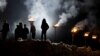 Kosovar Albanians participate in a bonfire ceremony &nbsp;on the &quot;Night of the Fires&quot; in the village of Prekaz on March 7. (AFP/Armend Nimani)