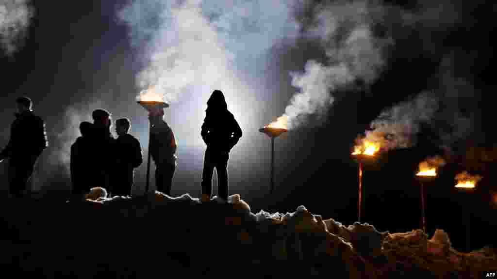 Kosovar Albanians participate in a bonfire ceremony &nbsp;on the &quot;Night of the Fires&quot; in the village of Prekaz on March 7. (AFP/Armend Nimani)