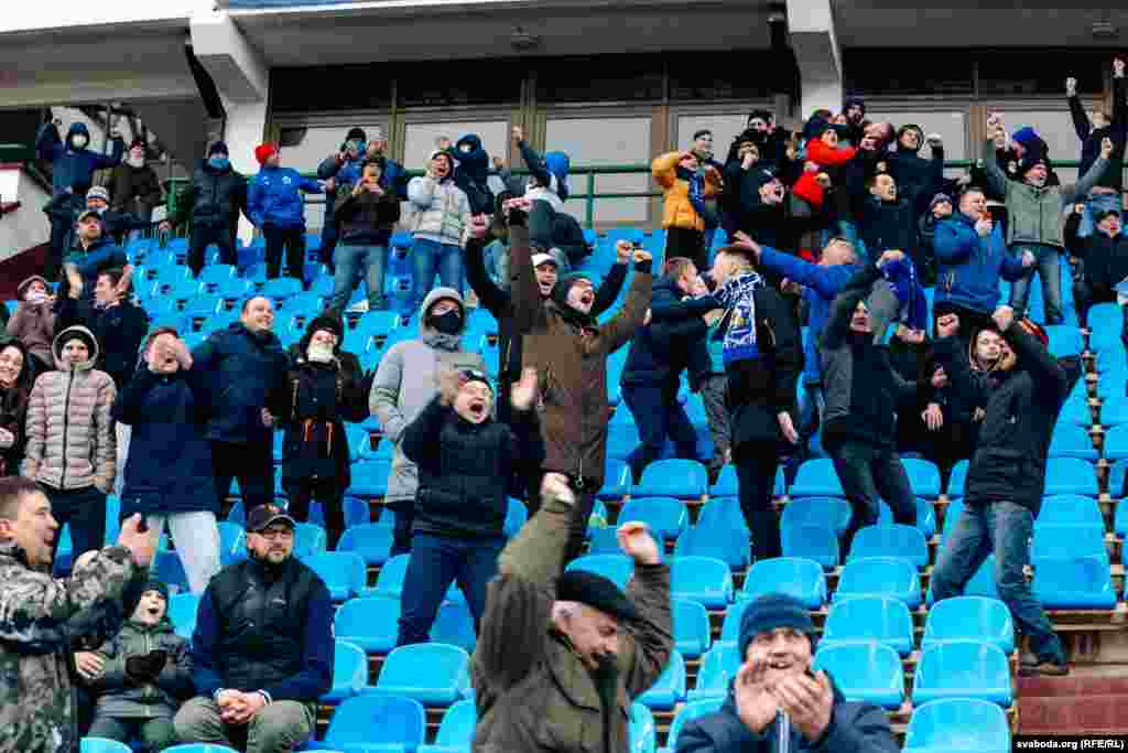 Fans without face masks cheer on the home team at the Vitebsk soccer stadium on April 18.