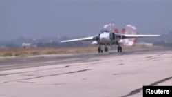 An image from video footage released by Russia's Defense Ministry earlier this month shows an Su-24 military jet slowing down at an airbase in Syria after a sortie. 