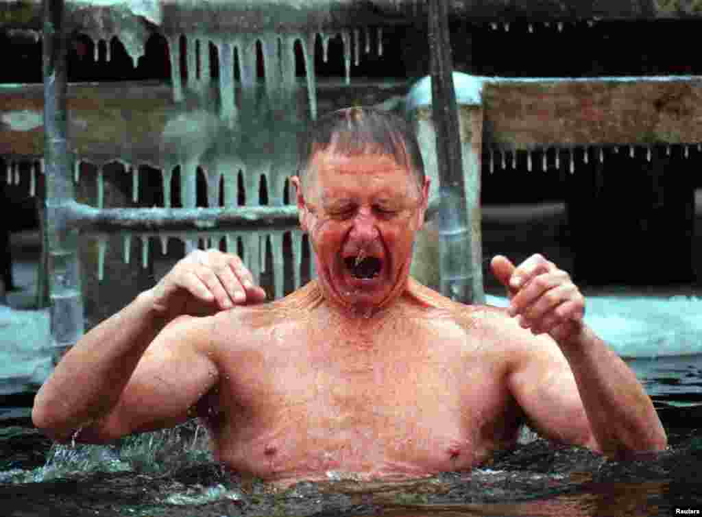 An elderly Belarusian hollers as he plunges into icy Lake Komsomolskoye. Starr, who has traveled to more than 90 countries, says she has found Belarusians “some of the most animated people I’ve ever met.”