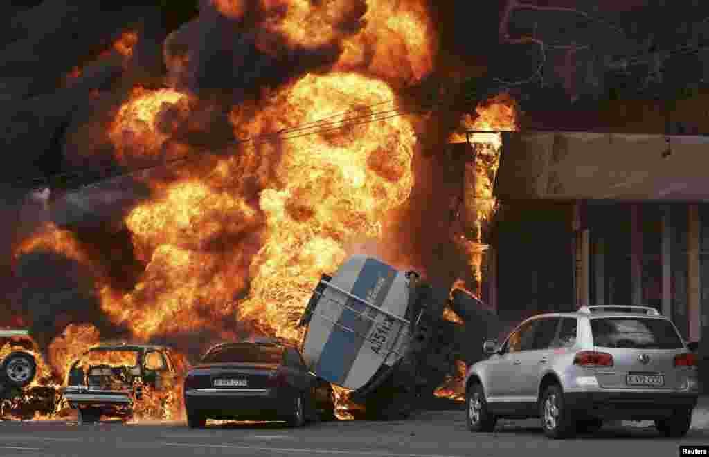 A traffic accident involving a gasoline tanker truck caused a huge fire in Almaty, Kazakhstan. The driver of the tanker died in the crash. Twenty nearby apartments were destroyed. (Reuters/Sergei Khodanov)