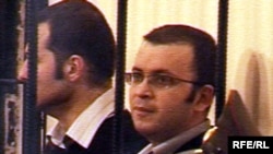 Emin Milli and Adnan Hajizada in detention in October