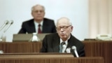 Physicist, dissident, and Nobel laureate Andrei Sakharov addresses the Congress of People's Deputies as Soviet President Mikhail Gorbachev looks on behind him in Moscow in December 1989.