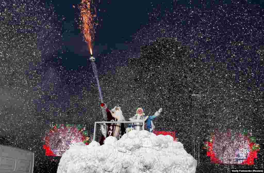 People dressed as Father Frost and the Snow Maiden take part in a seasonal procession in the center of Minsk, Belarus. (Reuters/Vasily Fedosonko)
