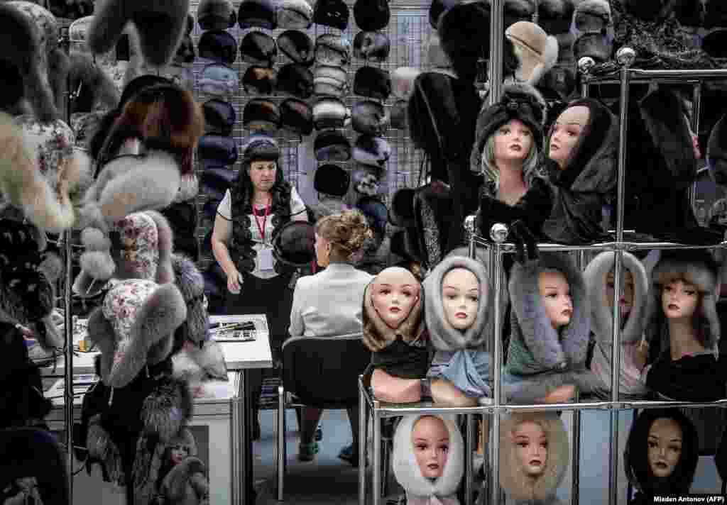 A vendor presents a collection of fur hats during an international fashion fair in Moscow. (AFP/Mladen Antonov)
