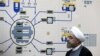 FILE - In this Jan. 13, 2015, file photo released by the Iranian President's Office, President Hassan Rouhani visits the Bushehr nuclear power plant just outside of Bushehr, Iran. Iran announced Tuesday it would inject uranium gas into 1,044 centrifuges i