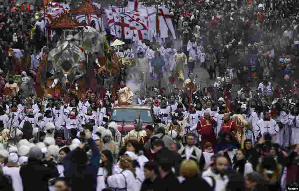 Participants march on the street during Alilo, a religious procession to celebrate Orthodox Christmas in Tbilisi, Georgia. (Reuters/David Mdzinarishvili)
