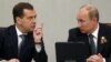 Could a generation gap be emerging in the Kremlin with a disconnect between older cronies of President Vladimir Putin (right) and younger individuals linked with Prime Minister Dmitry Medvedev? 