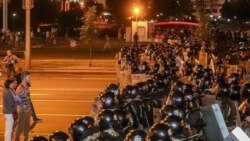 Protesters poured into the streets of Belarus's capital, Minsk, after the balloting ended, many of them facing off against riot police.