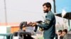 An Afghan police officer takes position near the site of an attack in Jalalabad on March 6. 