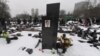 Snow covers the grave of lawyer Sergei Magnitsky with his portrait on the tomb at the Preobrazhenskoye cemetery in Moscow in December.