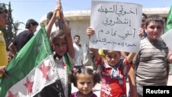 Syria -- Young demonstrators protest against Syria's President Bashar al-Assad in Al Kasten, near Idlib, 29Jun2012