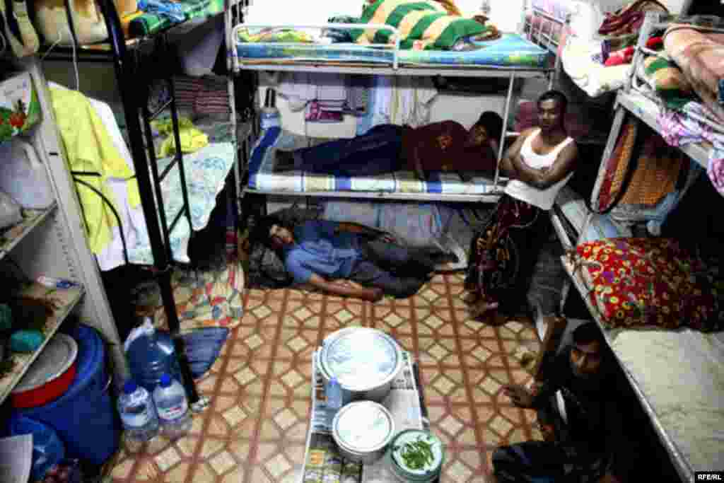 In the neighborhood of Deira, some 20 Pakistani workers share a 22-square-meter room, for which they each pay $55 a month.