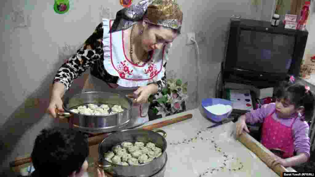 Making traditional food while the kids watch