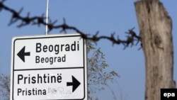 Kosovo -- A traffic sign at the entrance of the ethnically divided town of Mitrovica.