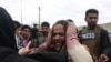 FILE: Family members cry after an attack on a Sikh Gudwara in the capital Kabul on March 25.