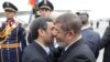 Deposed Egyptian President Muhammad Morsi (right) greets Iranian President Mahmud Ahmadinejad in Cairo in February.