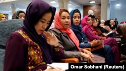 Afghan women attend a consultative grand assembly, known as a Loya Jirga, in Kabul. While they have gained rights like those to vote and to work, they are still faced with a patriarchy that denies them the right to their names.