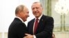 Turkey's President Recep Tayyip Erdogan, right, and Russia's President Vladimir Putin, greets each other in Tehran, Iran, prior to their talks as part of Russia-Iran-Turkey summit to discuss Syria, Friday Sept. 7, 2018. 