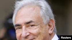 Dominique Strauss-Kahn leaves the hearing at the New York State Supreme Courthouse 