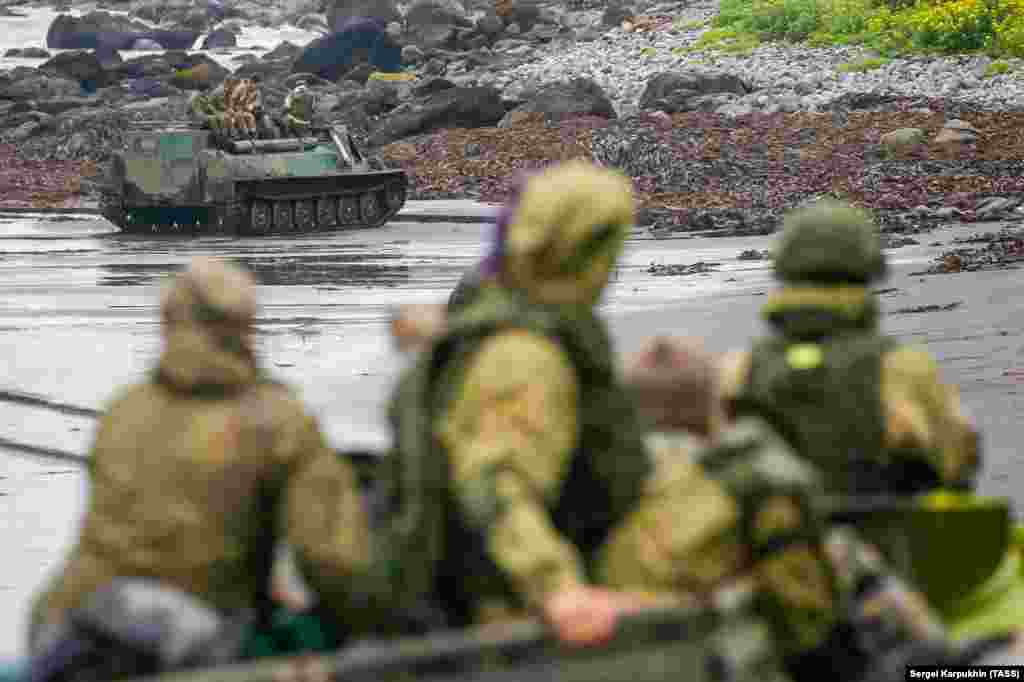 Tracked vehicles crawl along a beach on Iturup Island, one of the southernmost of the Kuriles. Iturup is one of several of the islands that are the subject of a seven-decade territorial dispute between Russia and Japan.