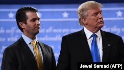Then-Republican presidential nominee Donald Trump (right) stands with his son Donald Trump Jr. after the first presidential debate at Hofstra University in Hempstead, New York, in September 2016.