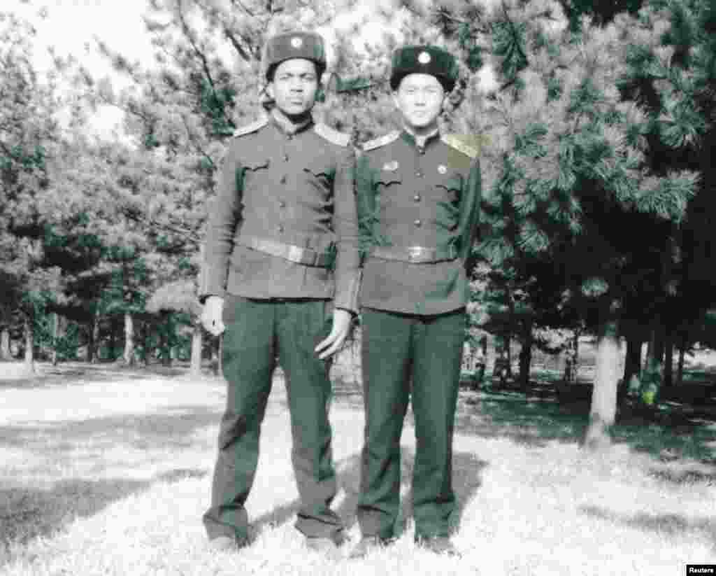 Francisco (left), Monique Macias's older brother, poses at the Mangyongdae Revolutionary School in Pyongyang in 1984.