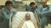 Vladimir Kara-Murza (center) recuperates in the hospital after he was poisoned in 2015. 