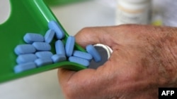 U.S. -- A pharmacist pours Truvada pills back into the bottle at Jack's Pharmacy in San Anselmo, California, 23Nov2010