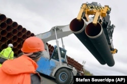 Steel pipes for the Nord Stream 2 pipeline are uploaded in Mukran harbor in Sassnitz, Germany.