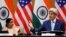 India - U.S. Secretary of State John Kerry (R) gestures as India's External Affairs Minister Sushma Swaraj looks on during their joint news conference in New Delhi, India, August 30, 2016
