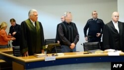 A pixilated picture of Andreas Anschlag (center), who has been accused along with his wife of spying for the Russian secret services in Germany.