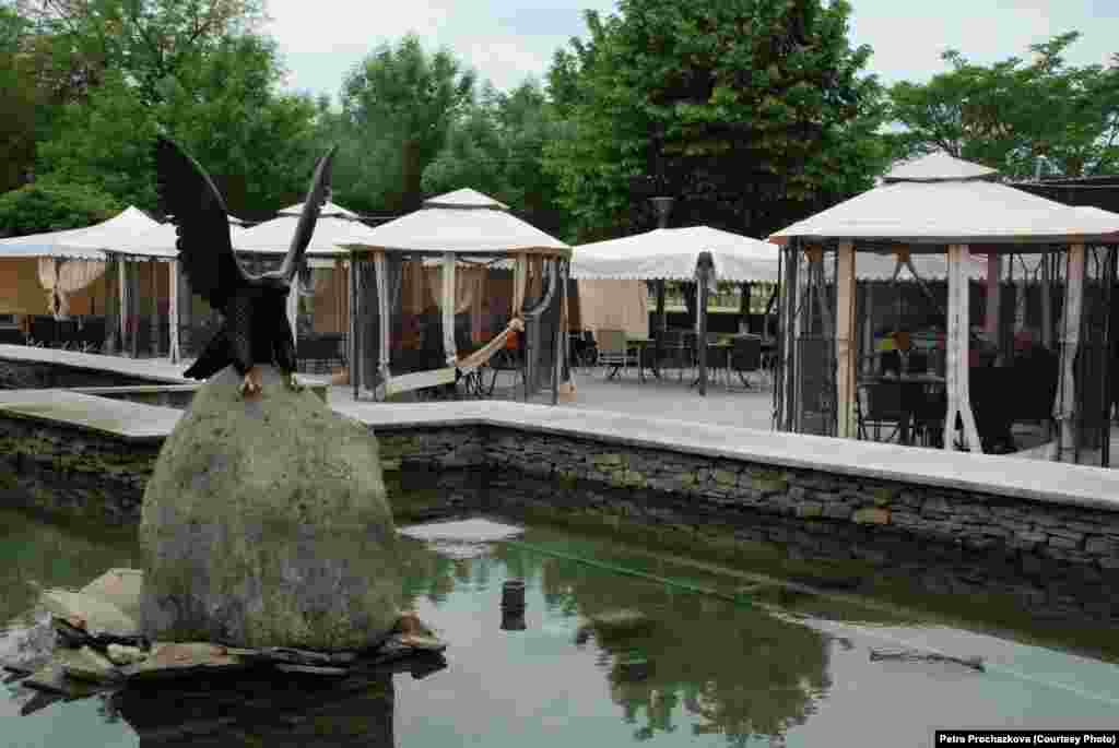 An outdoor cafe by a fountain, one of the sites to benefit from massive rebuilding efforts