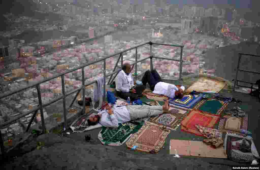 Muslim pilgrims visit Mount Al-Noor, where Muslims believe the Prophet Muhammad received the first words of the Koran through Gabriel in the Hera cave, in the holy city of Mecca, Saudi Arabia, on August 28. (Reuters/Suhaib Salem)